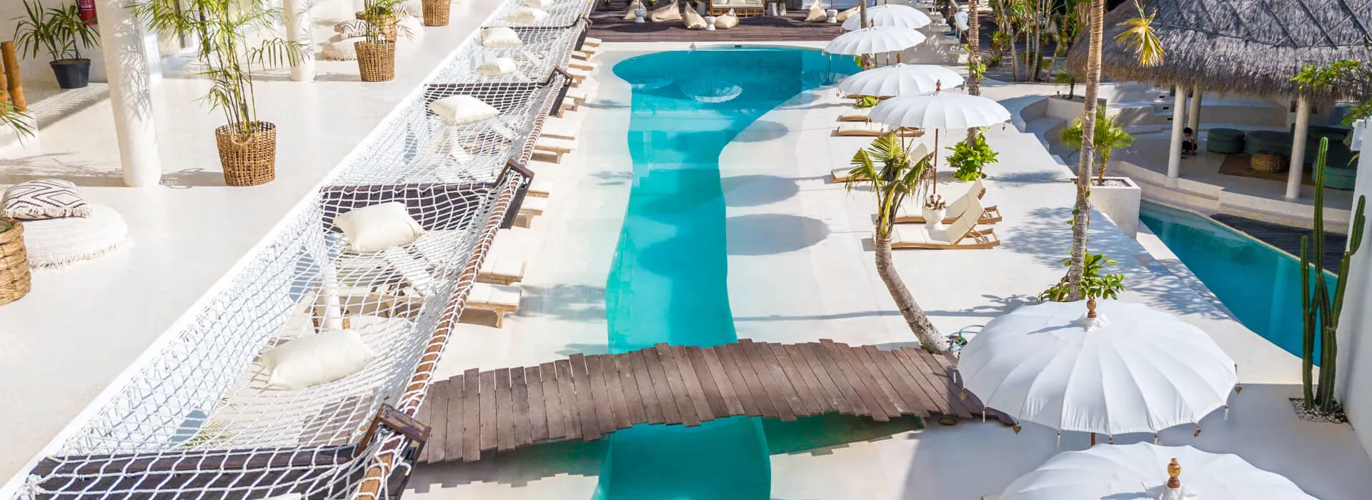 Resort pool deck with loungers and umbrellas