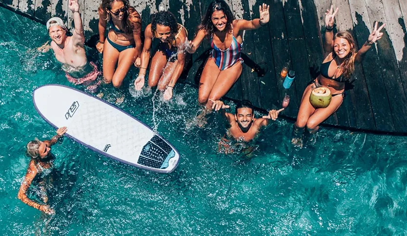 Guests enjoying water activities at Kima Surf Resort